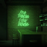 "STOP THINKING START DRINKING" NEON SKILT