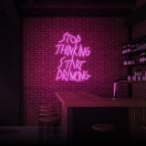 "STOP THINKING START DRINKING" NEON SKILT