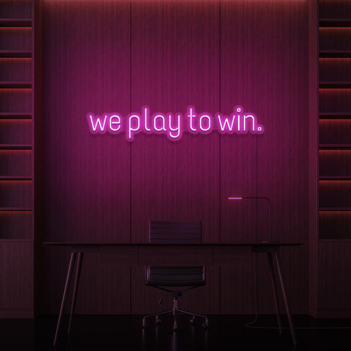 "WE PLAY TO WIN." NEON SKILT
