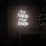 "STOP THINKING START DRINKING" NEON SKILT